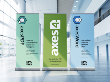 Three exhibition banners. The one on it.he left is about axesPDF and has a dark logo in a suqare form on a light background. The exhibition banner in the middle is about axes4 and is in the typical axes4 green color. This banner has a light logo in a horizontal form on it. The banner on the right is about axesWord and has a dark square logo and a light background on it.
