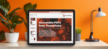 A screen with PowerPoint software open. The slide shows "Accessible PDFs from PowerPoint" and the axesSlide logo. In the background are plants and a lamp on an orange wall.